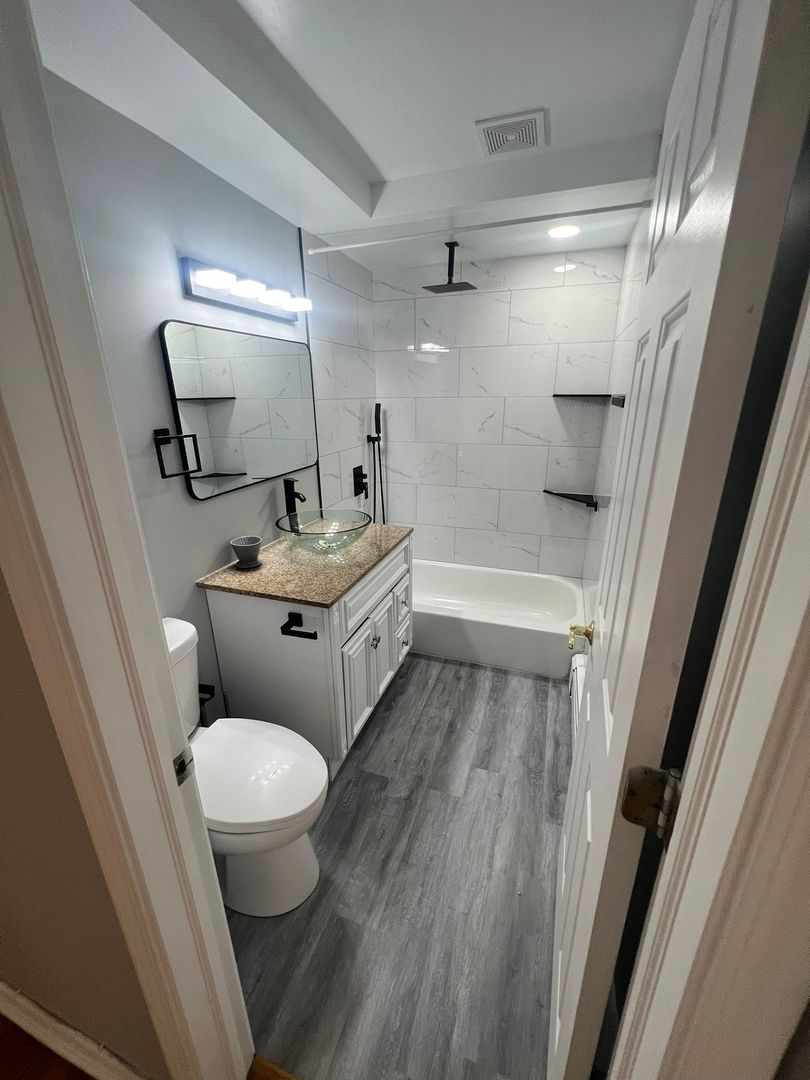 2348 West 111th Street, Unit 2 Chicago, IL 60643 - Photo 13 of 23 a bathroom with a sink toilet and shower