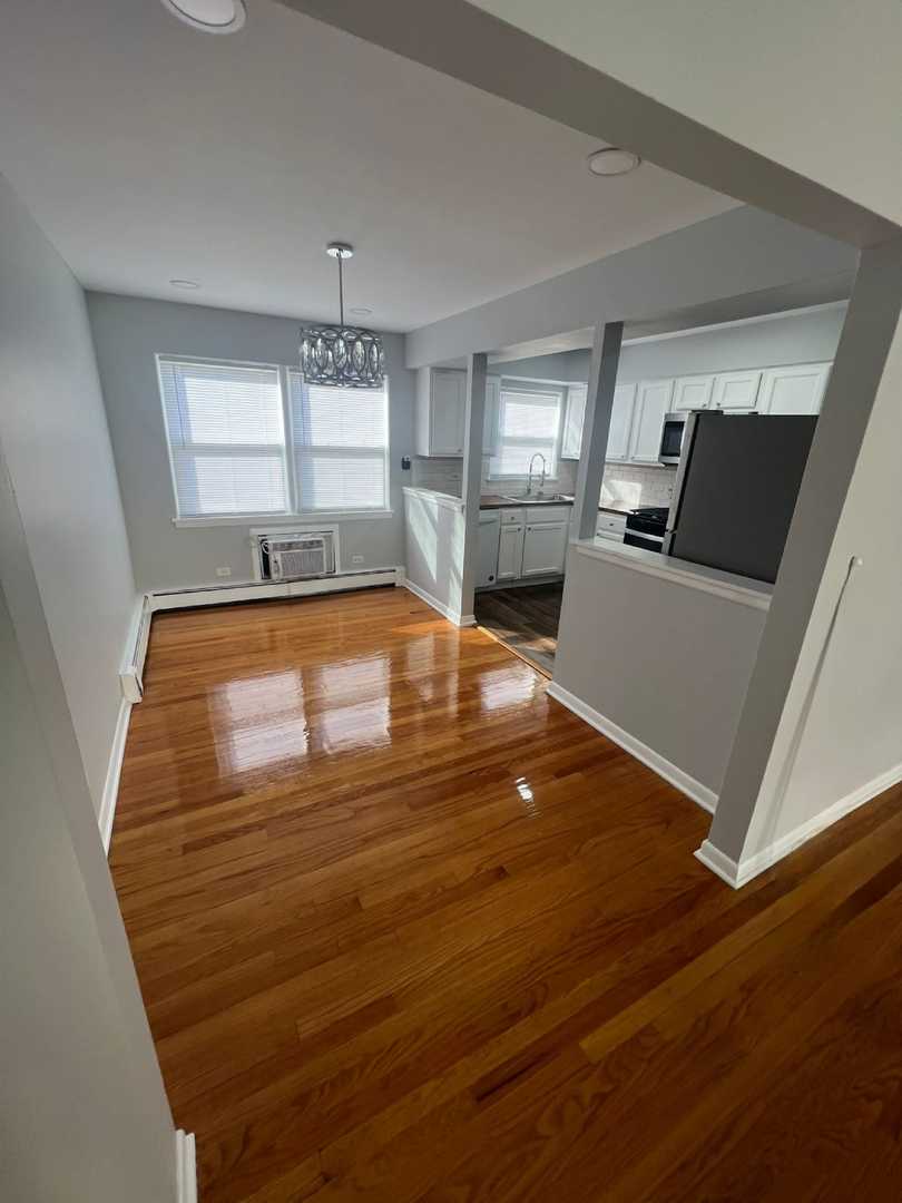 2348 West 111th Street, Unit 2 Chicago, IL 60643 - Photo 16 of 23 a room with wooden floor and furniture