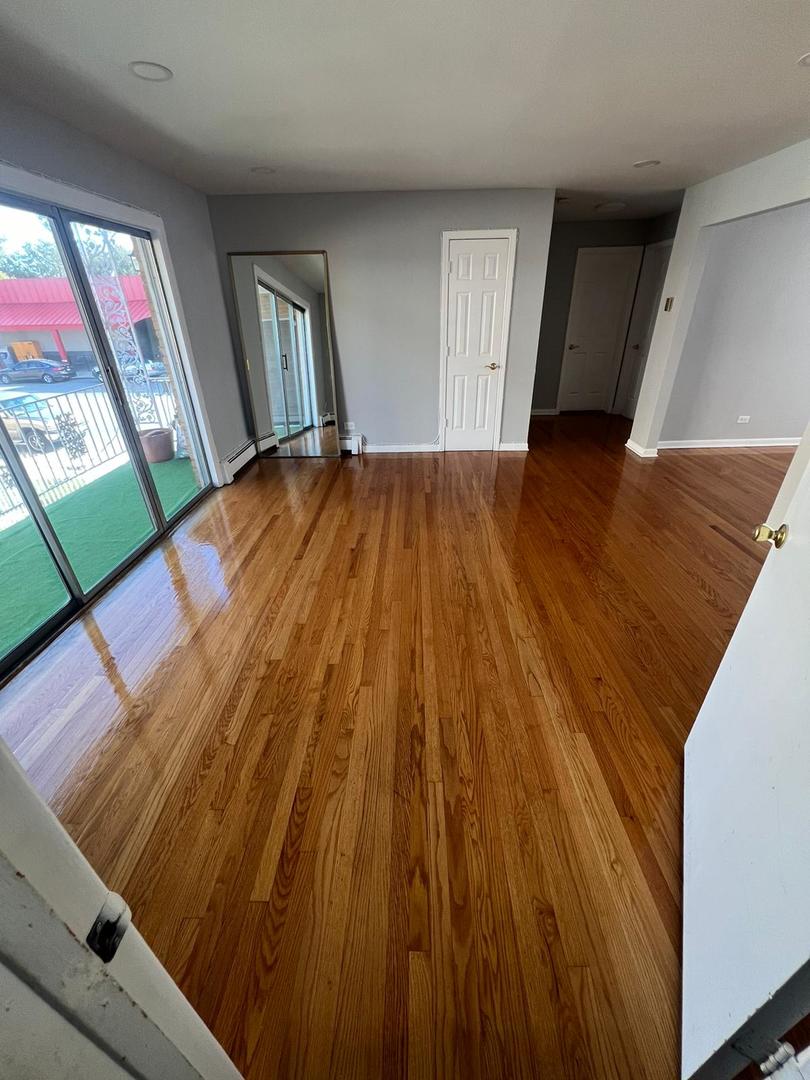 2348 West 111th Street, Unit 2 Chicago, IL 60643 - Photo 17 of 23 a view of empty room with wooden floor and fan