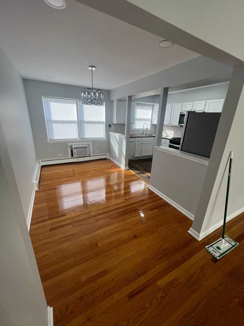 2348 West 111th Street, Unit 2 Chicago, IL 60643 - Photo 19 of 23 a room with wooden floor and furniture