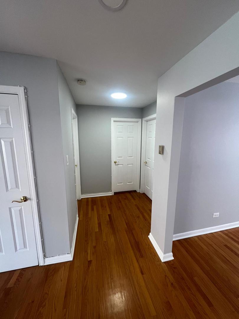 2348 West 111th Street, Unit 2 Chicago, IL 60643 - Photo 20 of 23 wooden floor in an empty room