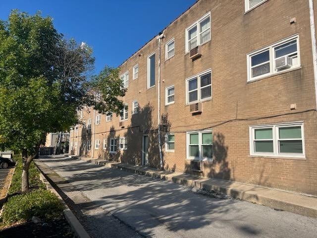 2348 West 111th Street, Unit 2 Chicago, IL 60643 - Photo 21 of 23 a front view of a building with outdoor seating