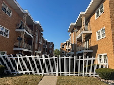 2348 West 111th Street, Unit 2 Chicago, IL 60643 - Photo 22 of 23 a view of a brick building with many windows