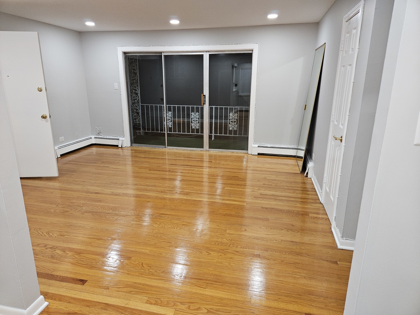 2348 West 111th Street, Unit 2 Chicago, IL 60643 - Photo 9 of 23 a view of an empty room with wooden floor