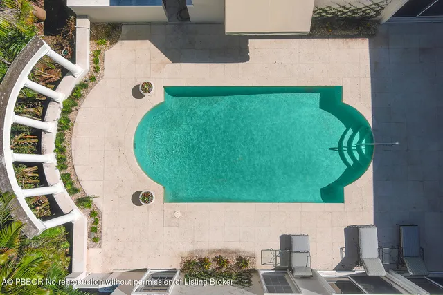 an aerial view of a swimming pool