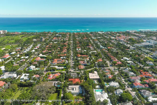 an aerial view of residential building and ocean