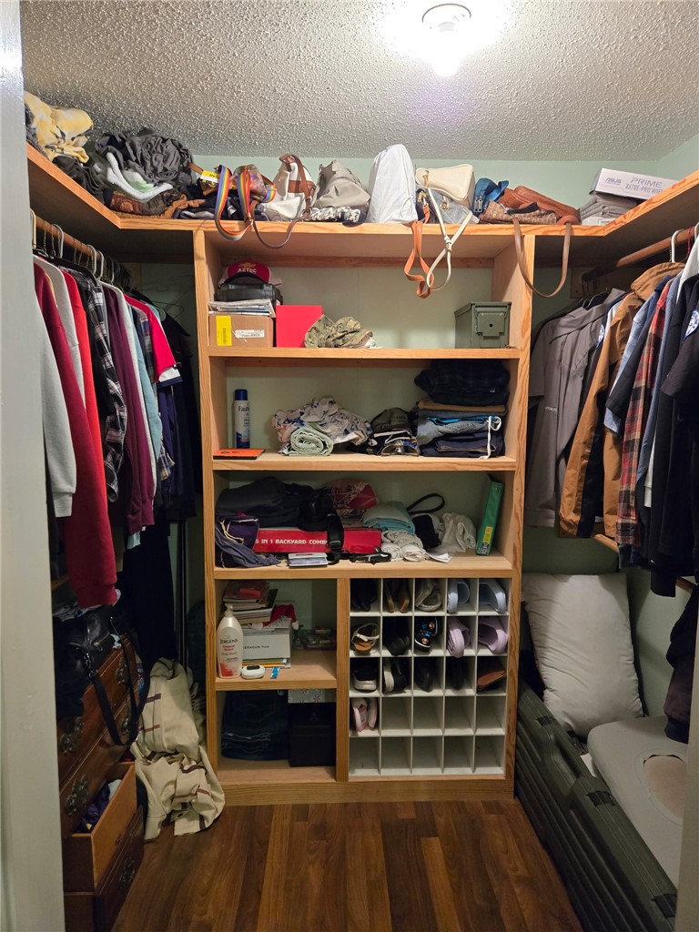 24772 County Road 360 Mathis, TX 78368 - Photo 10 of 30 a view of walk in closet with clothes and shoes