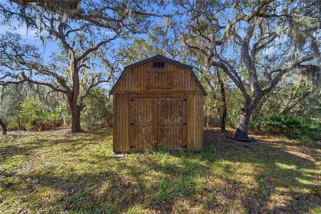 a view of a backyard of the house