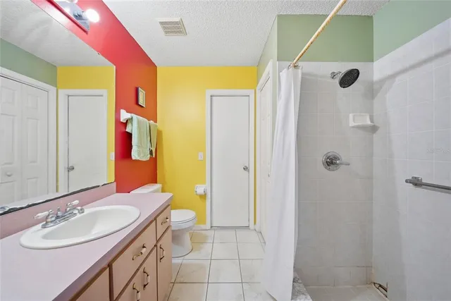 a bathroom with a sink vanity and a mirror