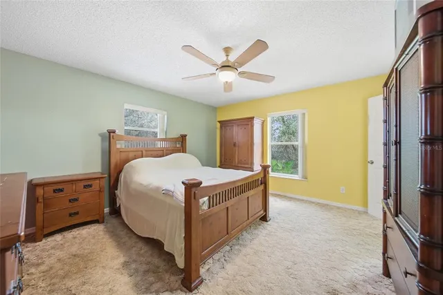 a bed room with a bed and a window