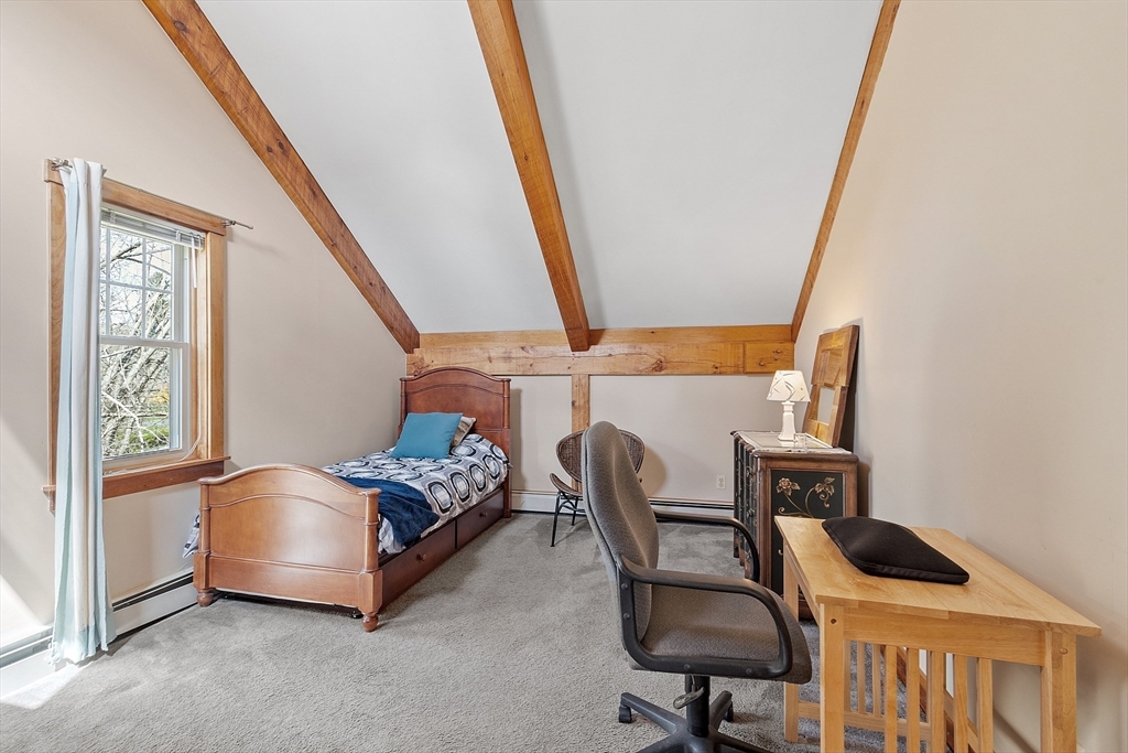 31 Dutton Road Pelham, NH 03076 - Photo 19 of 36 a bedroom with furniture and a window