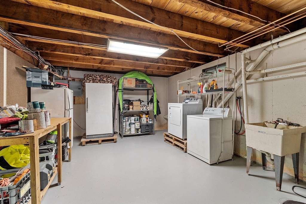 31 Dutton Road Pelham, NH 03076 - Photo 25 of 36 a view of a storage room with racks