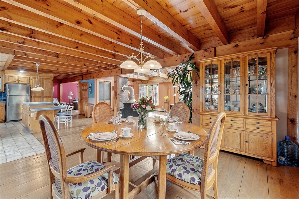 31 Dutton Road Pelham, NH 03076 - Photo 8 of 36 a view of a dining room with furniture and chandelier