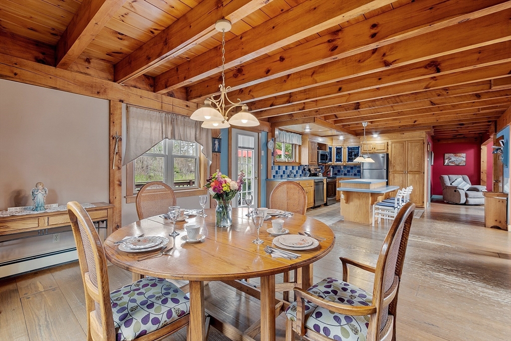 31 Dutton Road Pelham, NH 03076 - Photo 9 of 36 a view of a dining room with furniture