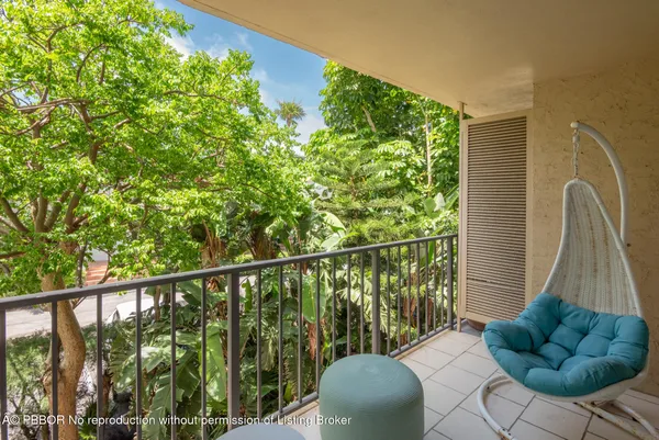 a view of balcony with furniture