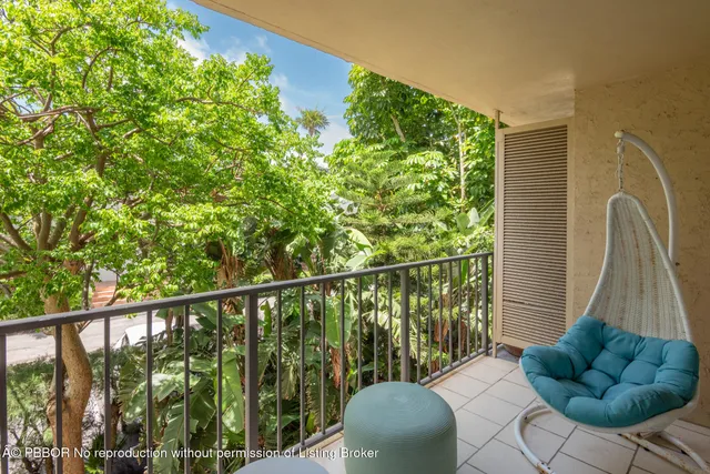 a view of balcony with furniture