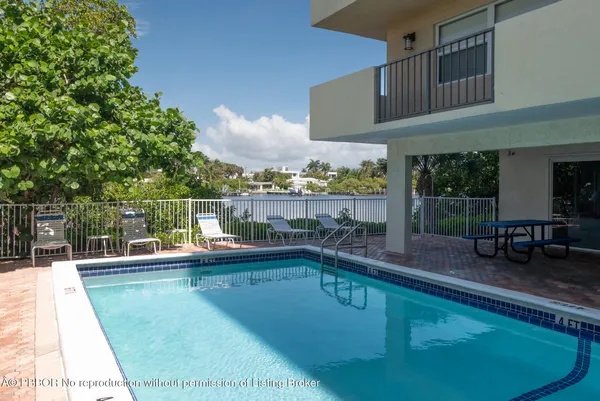 a view of a swimming pool with a patio