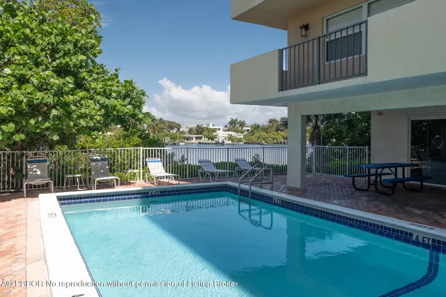 a view of a swimming pool with a patio