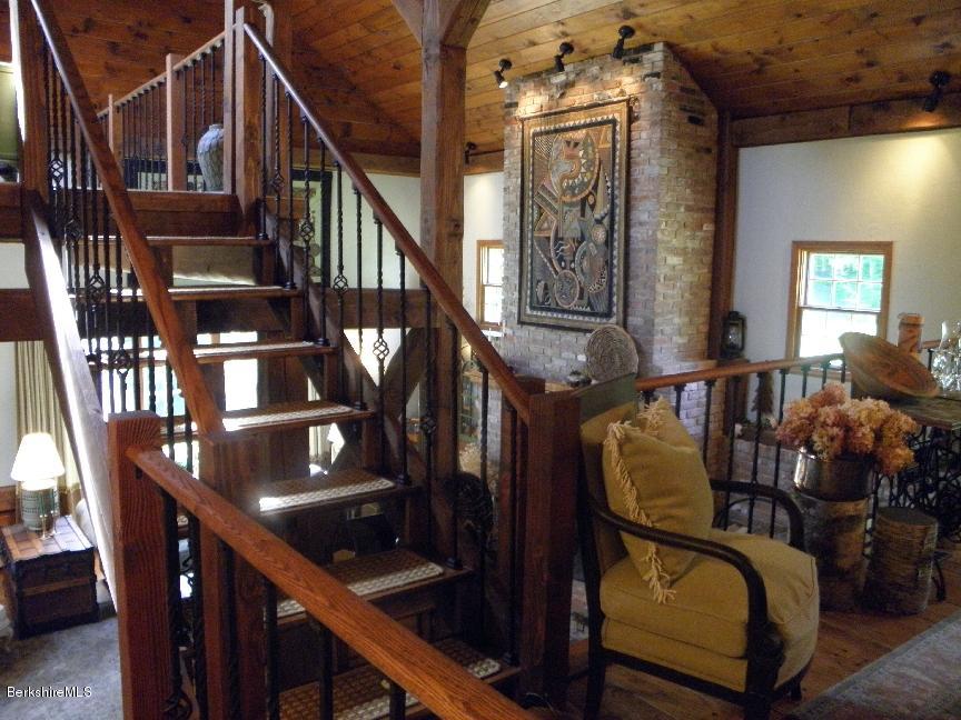 661 High St Hill Road Windsor, MA 01270 - Photo 21 of 75 a view of staircase with lots of frames on wall and a chandelier