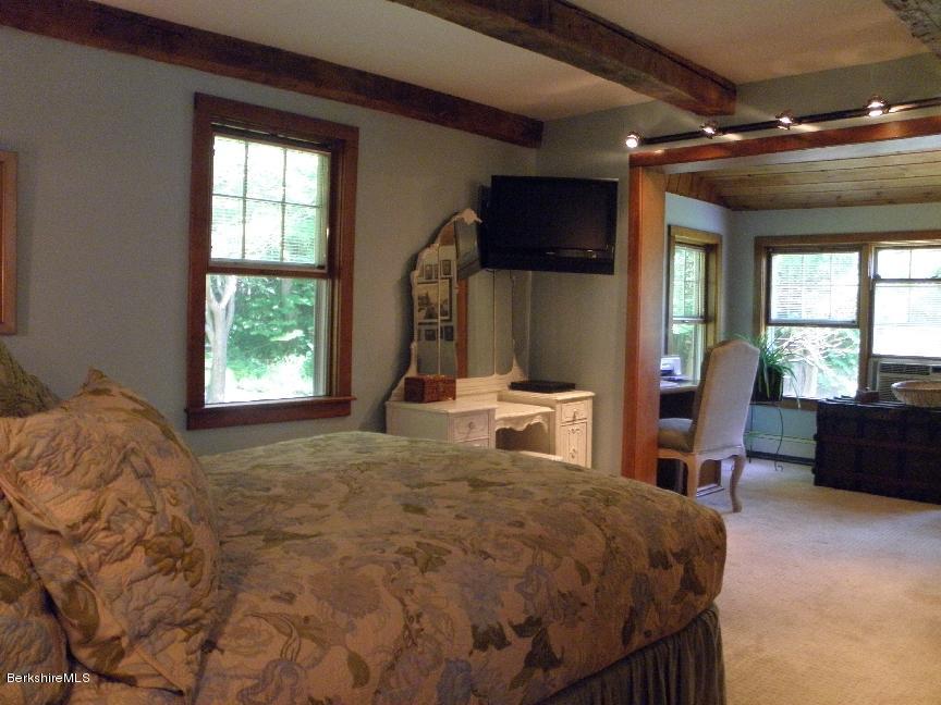 661 High St Hill Road Windsor, MA 01270 - Photo 36 of 75 a bed sitting in a room next to a window