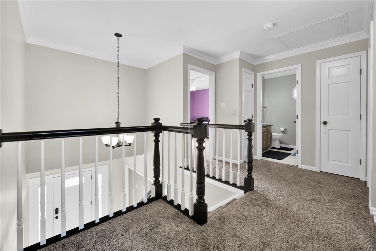 607 Cottage Road Batavia, IL 60510 - Photo 12 of 36 a view of a hallway with chandelier