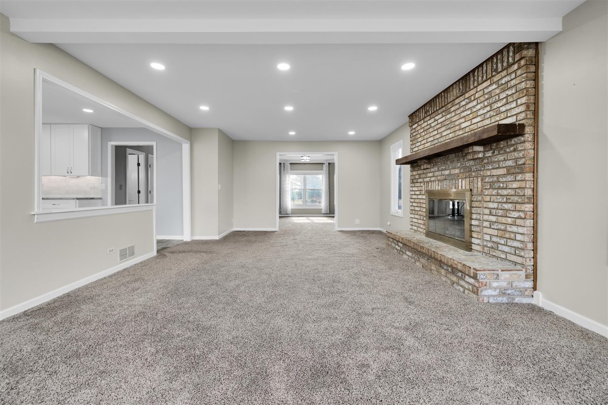 607 Cottage Road Batavia, IL 60510 - Photo 15 of 36 a view of an empty room with a fireplace
