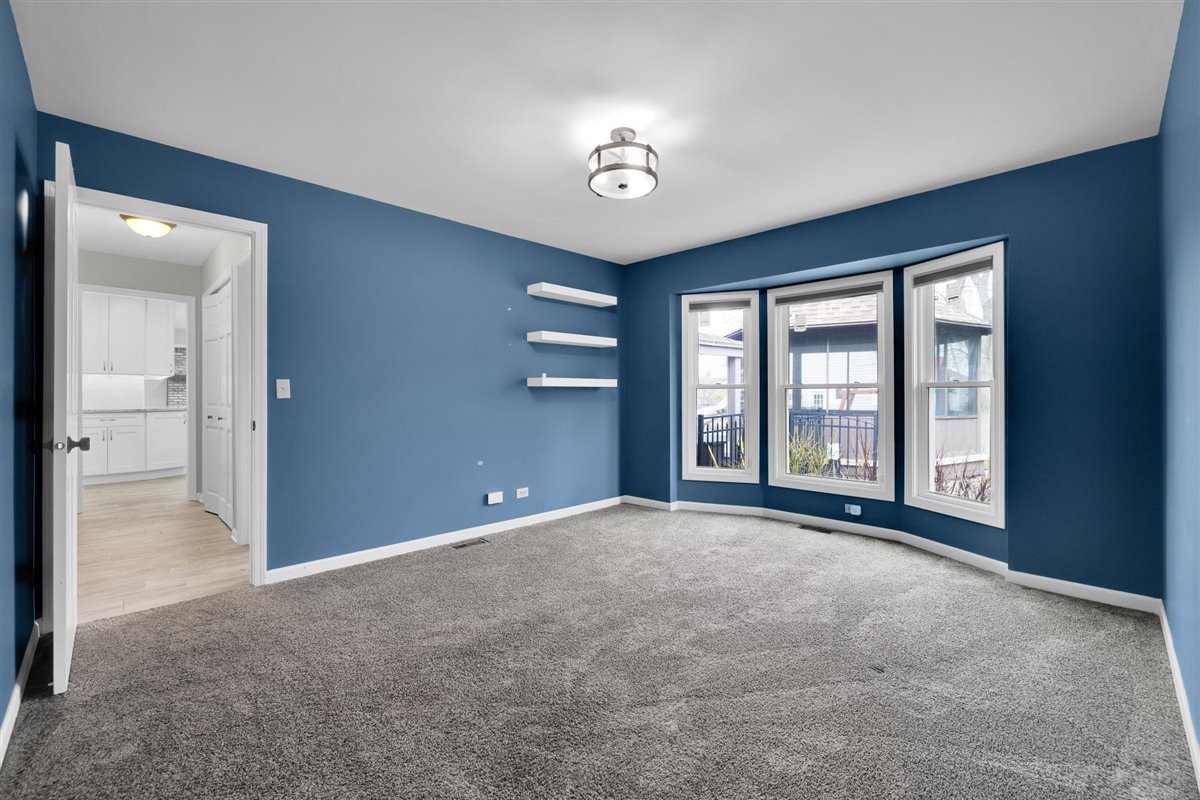 607 Cottage Road Batavia, IL 60510 - Photo 16 of 36 a view of an empty room with a window