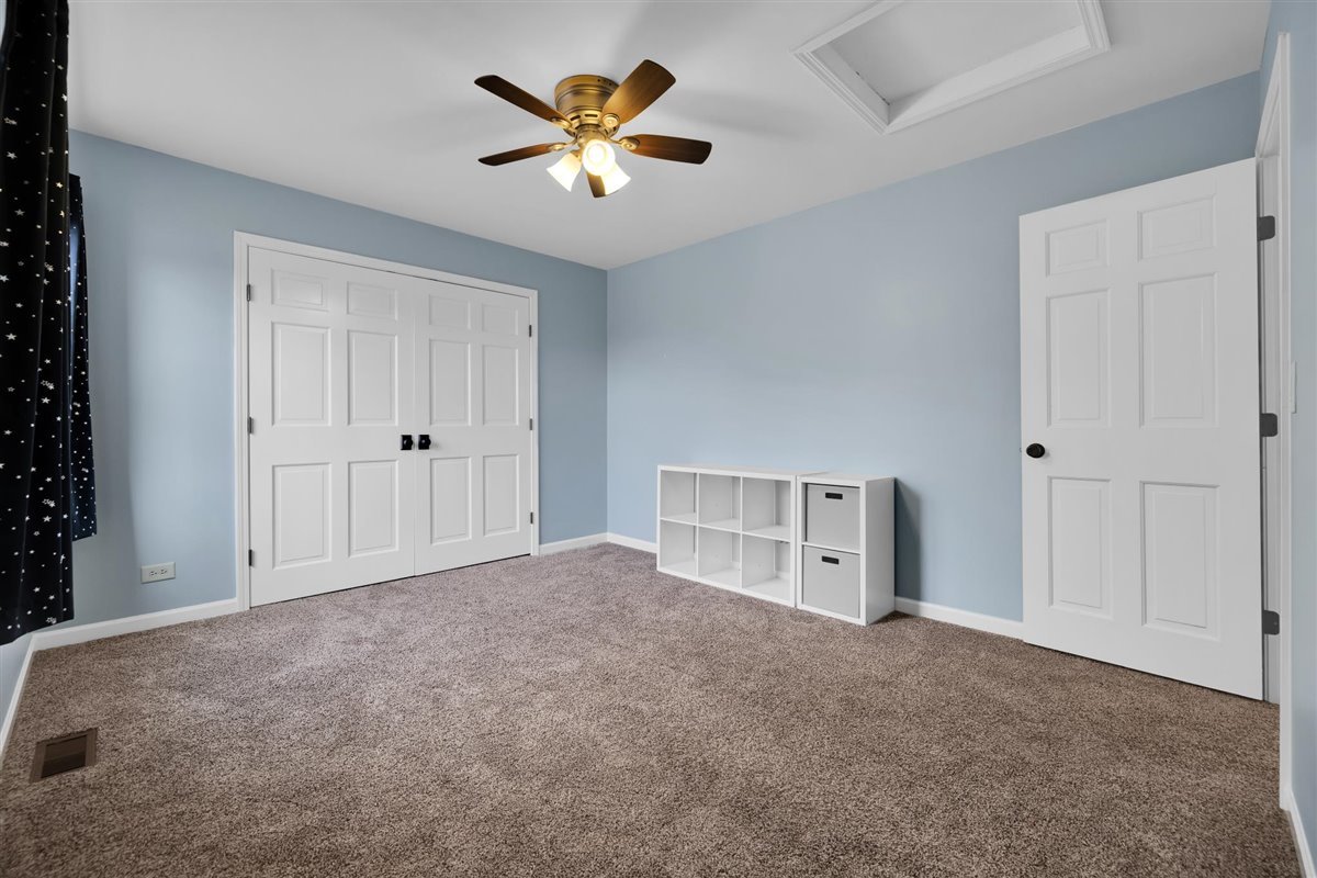 607 Cottage Road Batavia, IL 60510 - Photo 20 of 36 an empty room with closet and fan