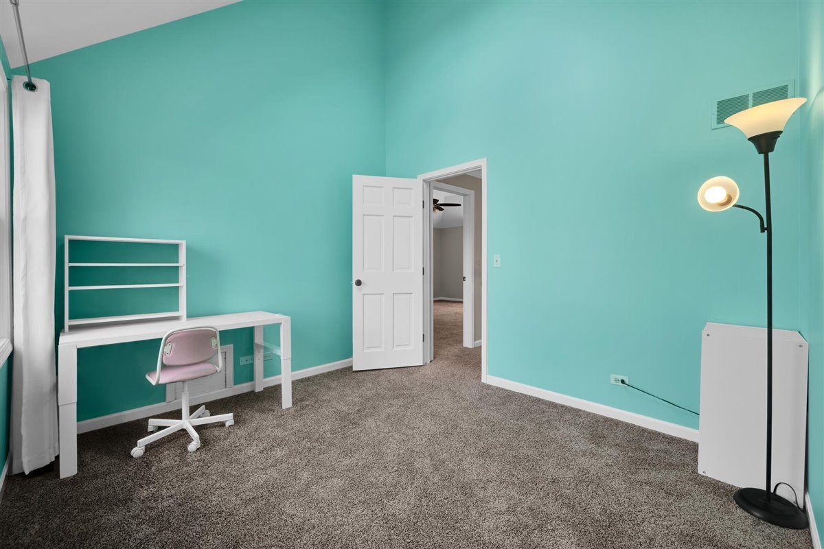 607 Cottage Road Batavia, IL 60510 - Photo 23 of 36 a room with a chair and a large window