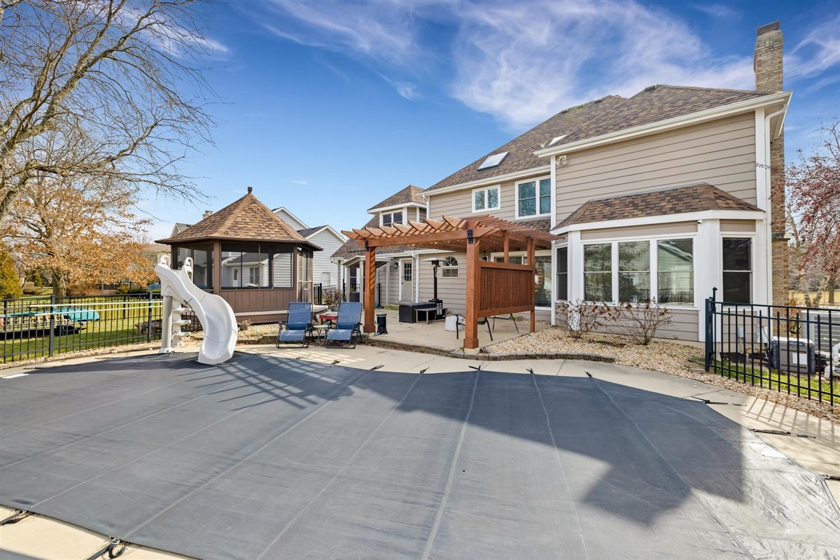 607 Cottage Road Batavia, IL 60510 - Photo 36 of 36 a front view of a house with a garden and balcony