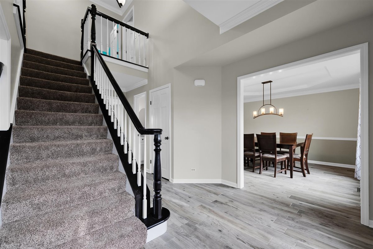 607 Cottage Road Batavia, IL 60510 - Photo 4 of 36 a view of a livingroom with furniture and stairs