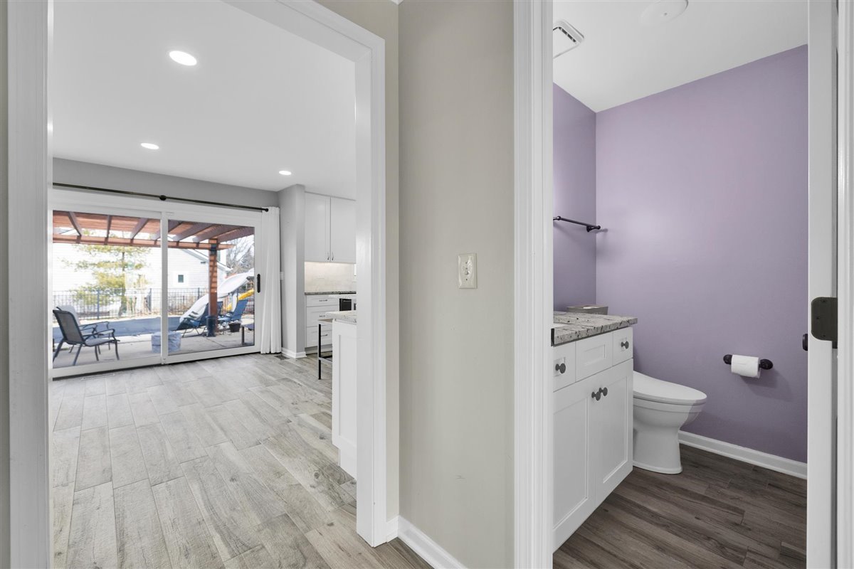 607 Cottage Road Batavia, IL 60510 - Photo 8 of 36 a view of a hallway with wooden floor and a bathroom