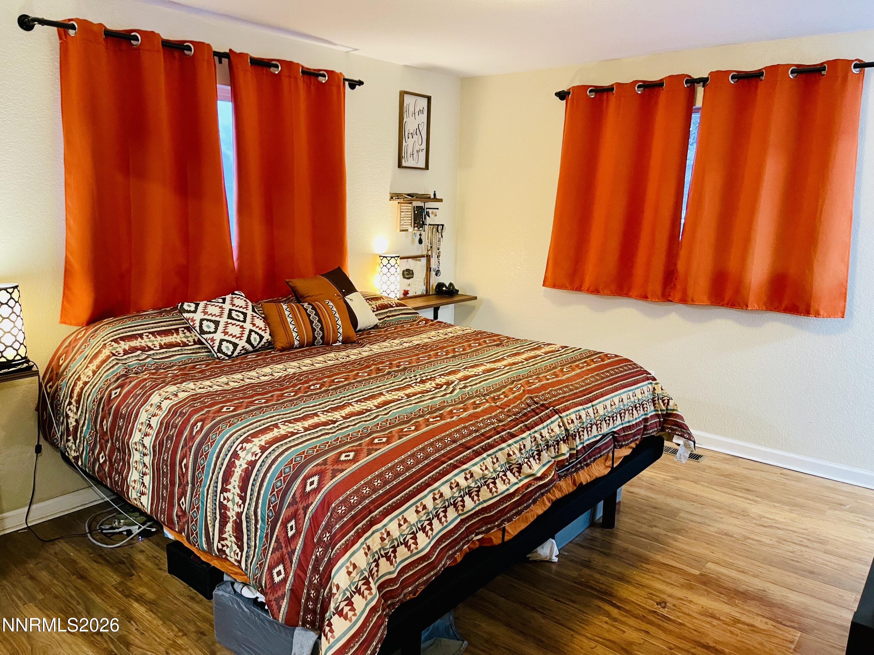334 Kay Way Yerington, NV 89447 - Photo 18 of 22 a bedroom with a bed and a window