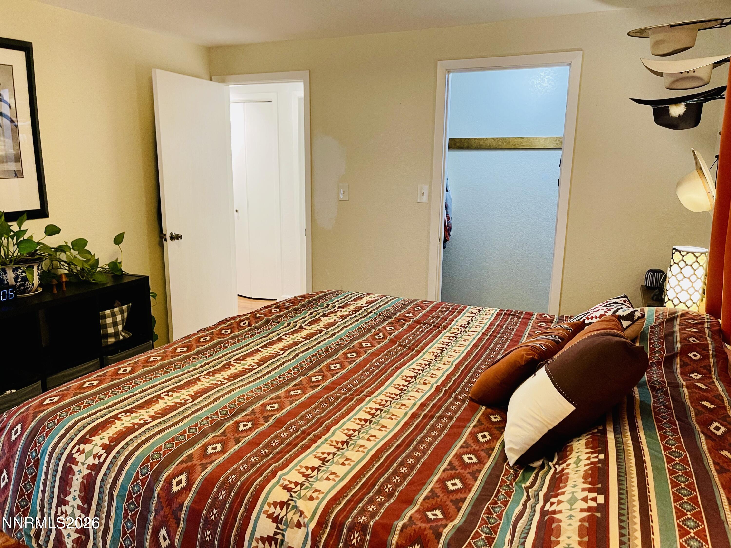 334 Kay Way Yerington, NV 89447 - Photo 19 of 22 a bedroom with a bed and a dresser