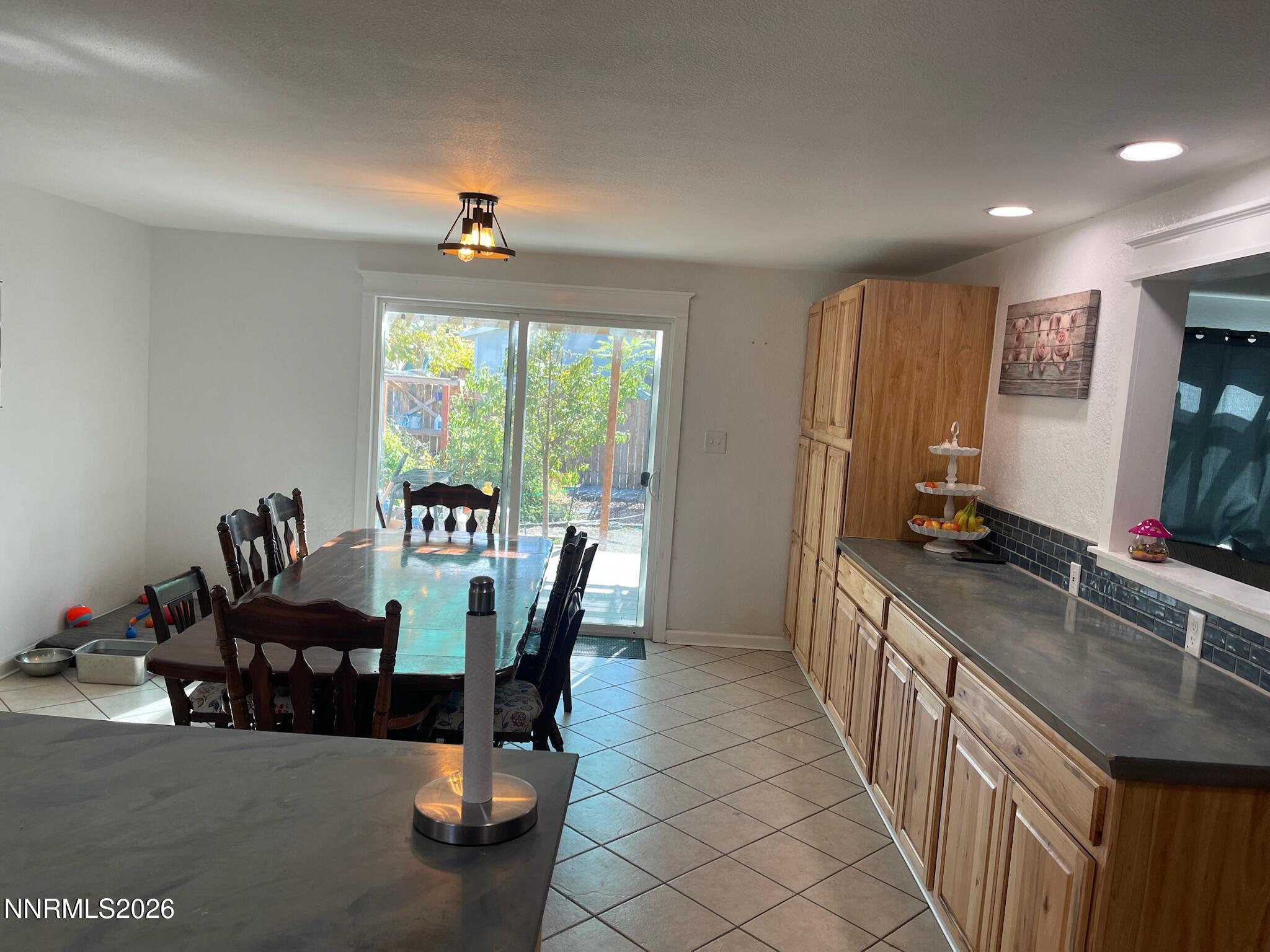 334 Kay Way Yerington, NV 89447 - Photo 5 of 22 a dining room with furniture and a chandelier