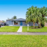 a view of a house with a swimming pool