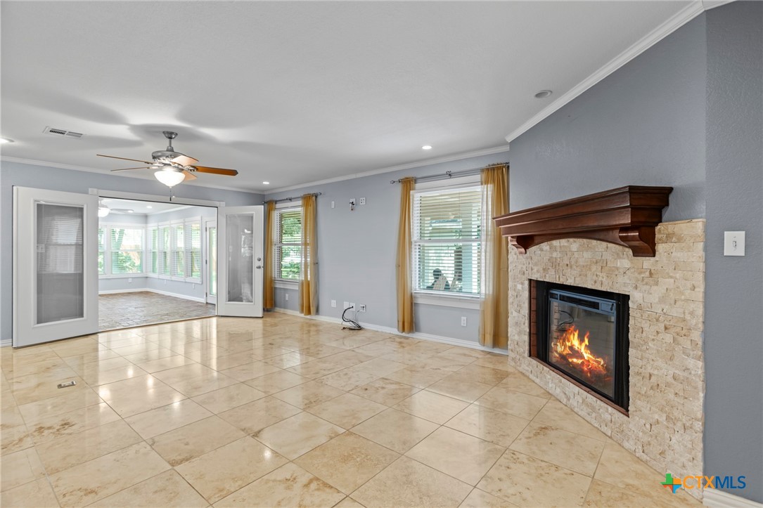 3745-3735 Canyon Heights Road Belton, TX 76513 - Photo 13 of 33 a view of an empty room with fireplace and a window