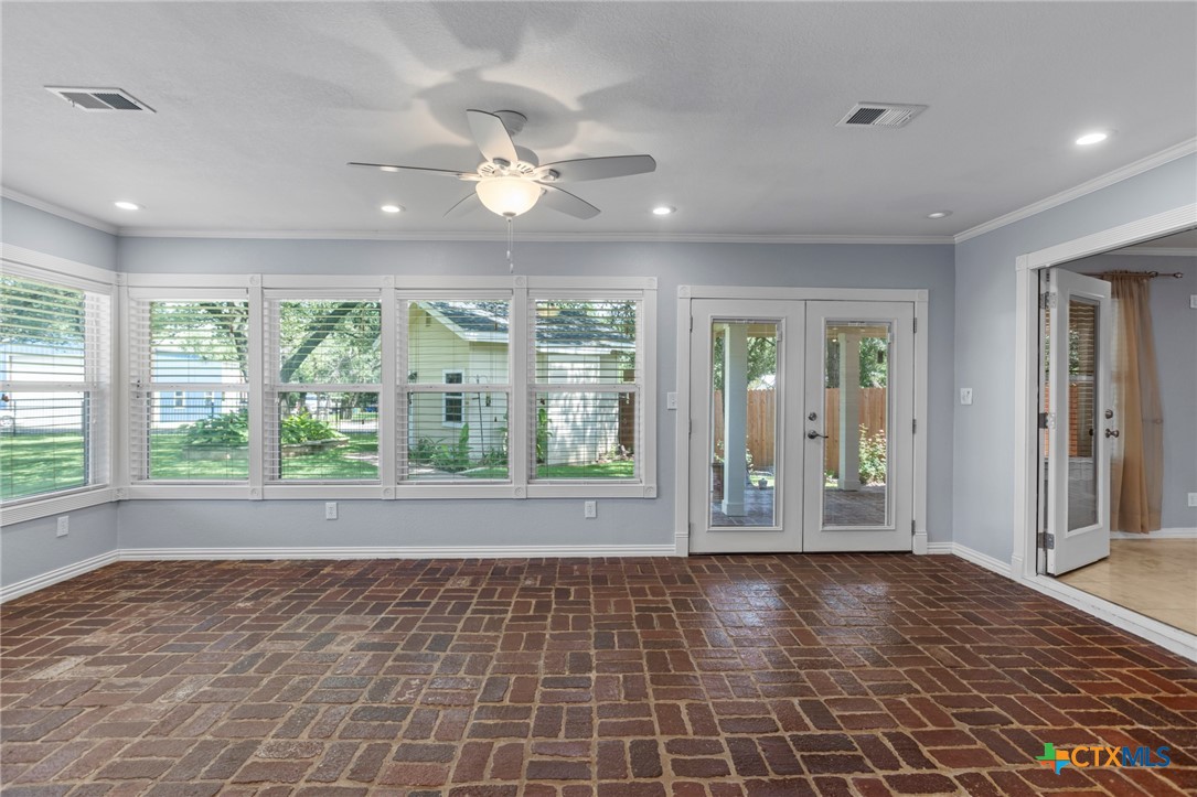 3745-3735 Canyon Heights Road Belton, TX 76513 - Photo 14 of 33 a view of an empty room with wooden floor and a window