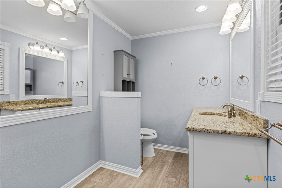 3745-3735 Canyon Heights Road Belton, TX 76513 - Photo 19 of 33 a bathroom with a sink and a mirror