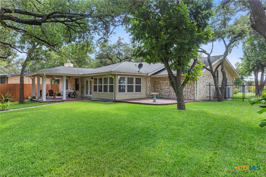 3745-3735 Canyon Heights Road Belton, TX 76513 - Photo 27 of 33 a front view of a house with a garden