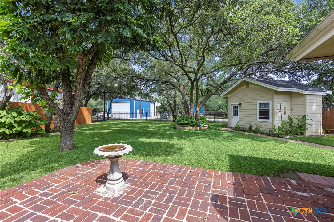 3745-3735 Canyon Heights Road Belton, TX 76513 - Photo 31 of 33 a front view of a house with a yard table and chairs