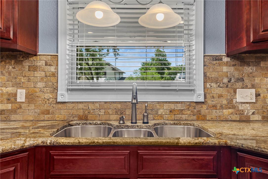 3745-3735 Canyon Heights Road Belton, TX 76513 - Photo 9 of 33 a kitchen with sink and window