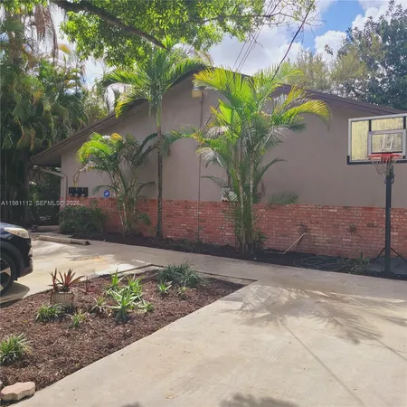 a plant in front of a house