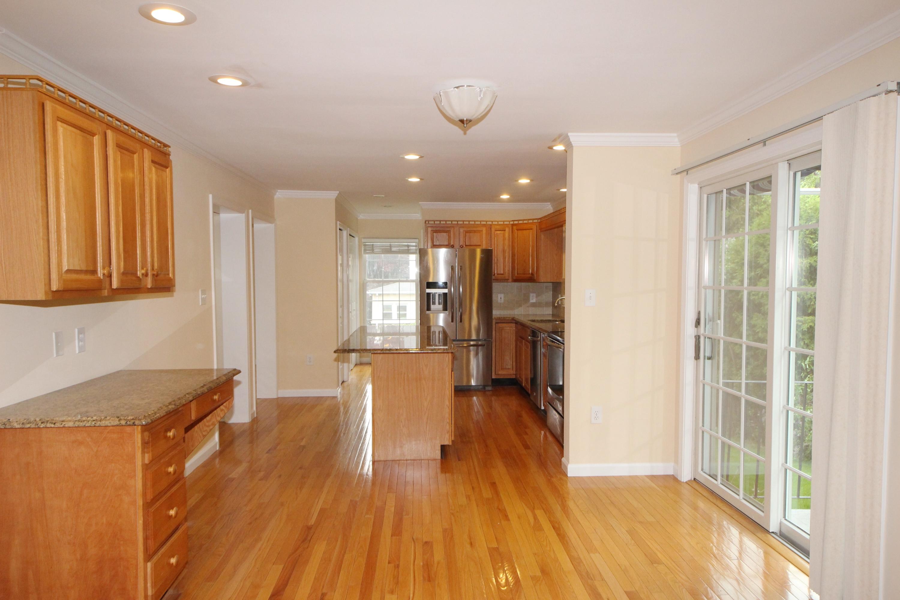 189 Hollow Tree Ridge Road Darien, CT 06820 - Photo 11 of 27 a view of a kitchen with furniture and wooden floor