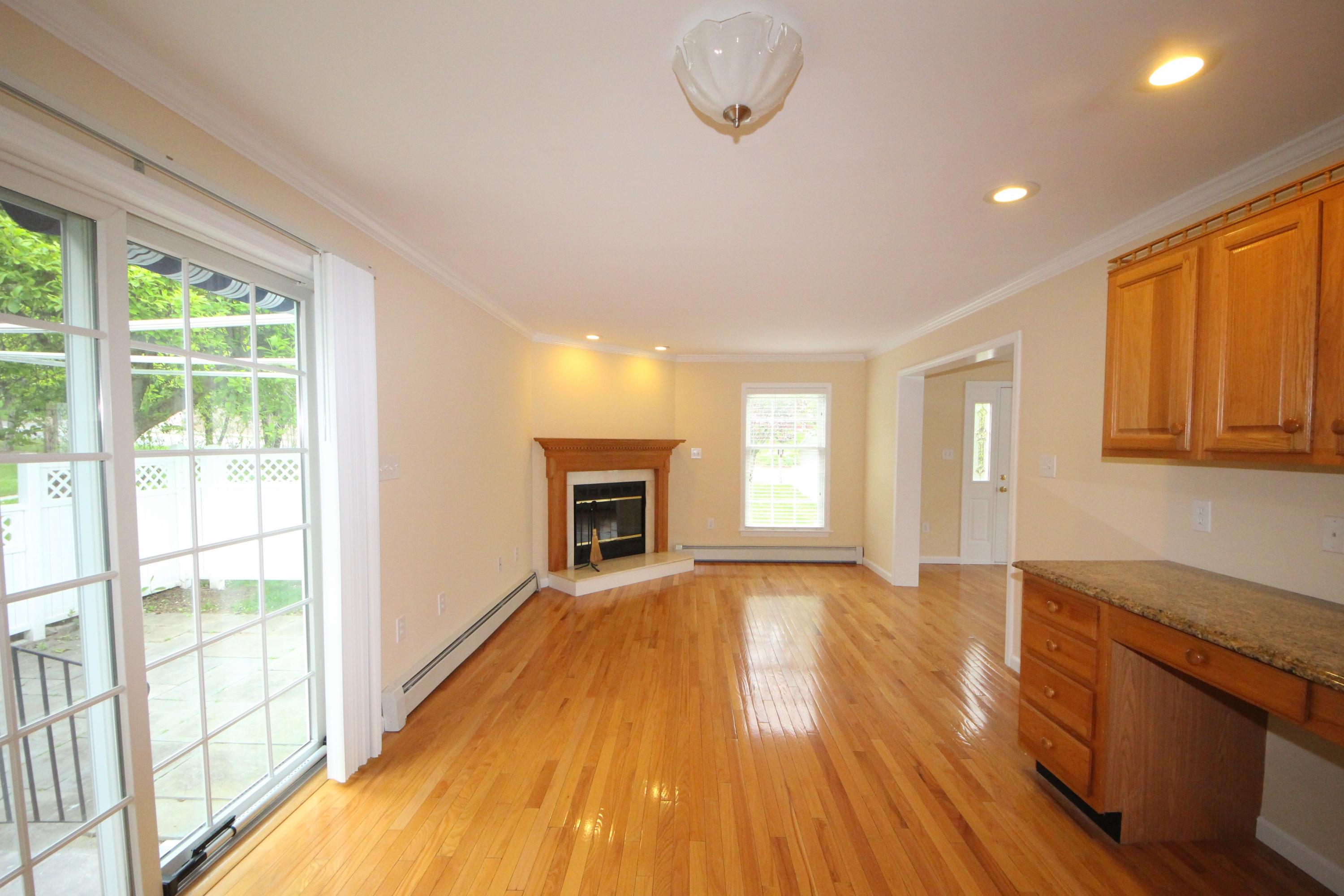 189 Hollow Tree Ridge Road Darien, CT 06820 - Photo 13 of 27 a view of an empty room with a window and wooden floor
