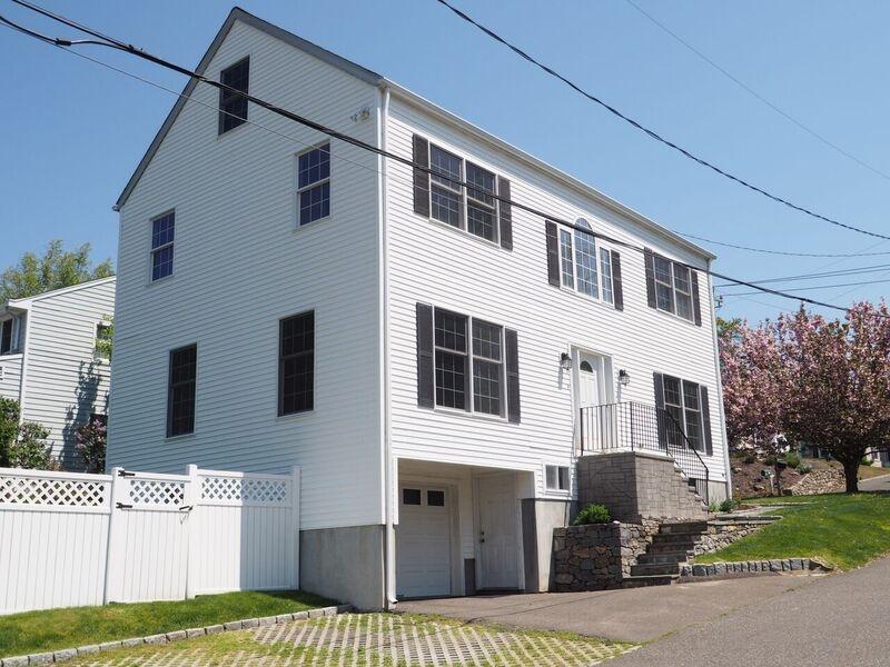 189 Hollow Tree Ridge Road Darien, CT 06820 - Photo 2 of 27 a front view of a house with a yard