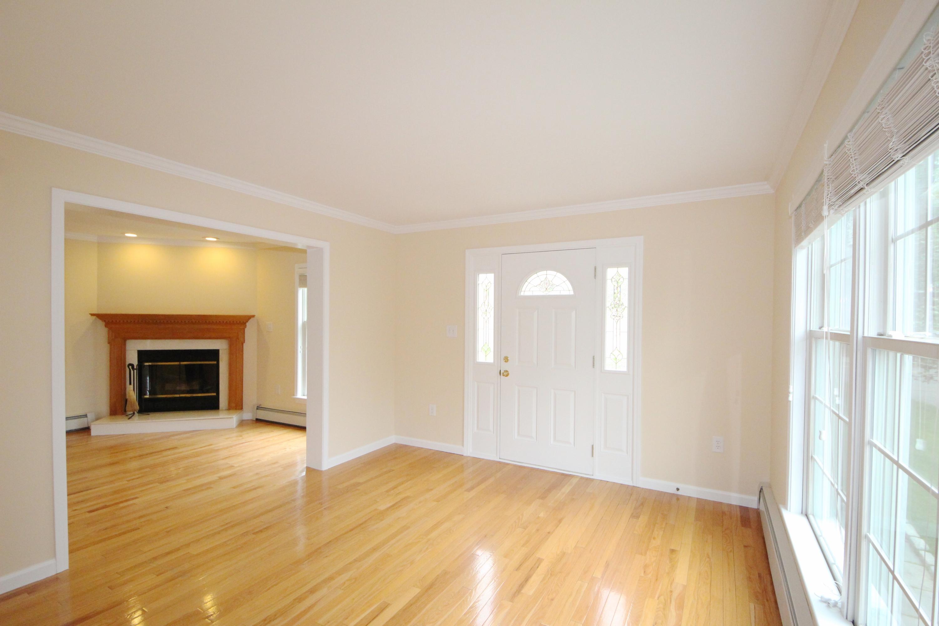 189 Hollow Tree Ridge Road Darien, CT 06820 - Photo 5 of 27 a view of empty room with wooden floor and fan