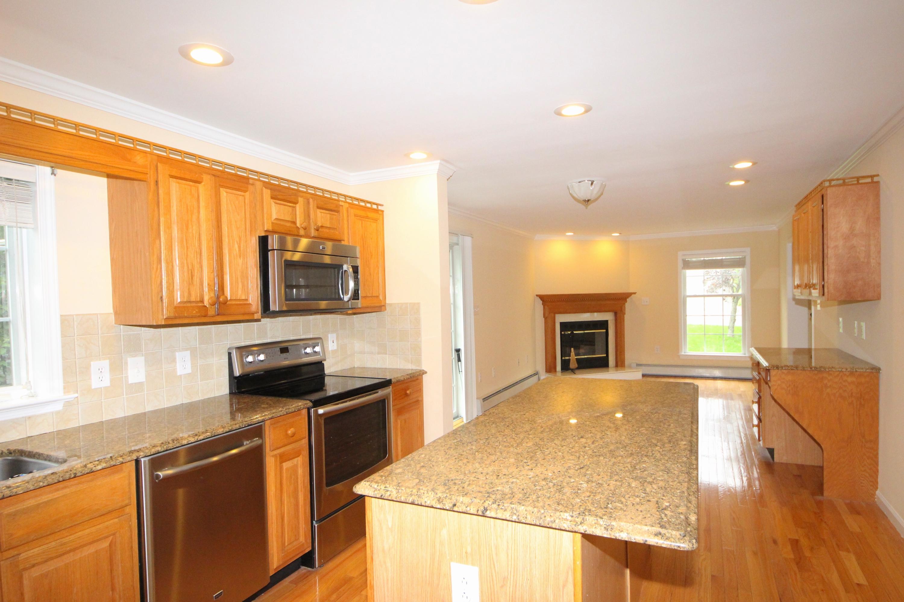 189 Hollow Tree Ridge Road Darien, CT 06820 - Photo 10 of 27 a kitchen with stainless steel appliances granite countertop a sink stove and refrigerator