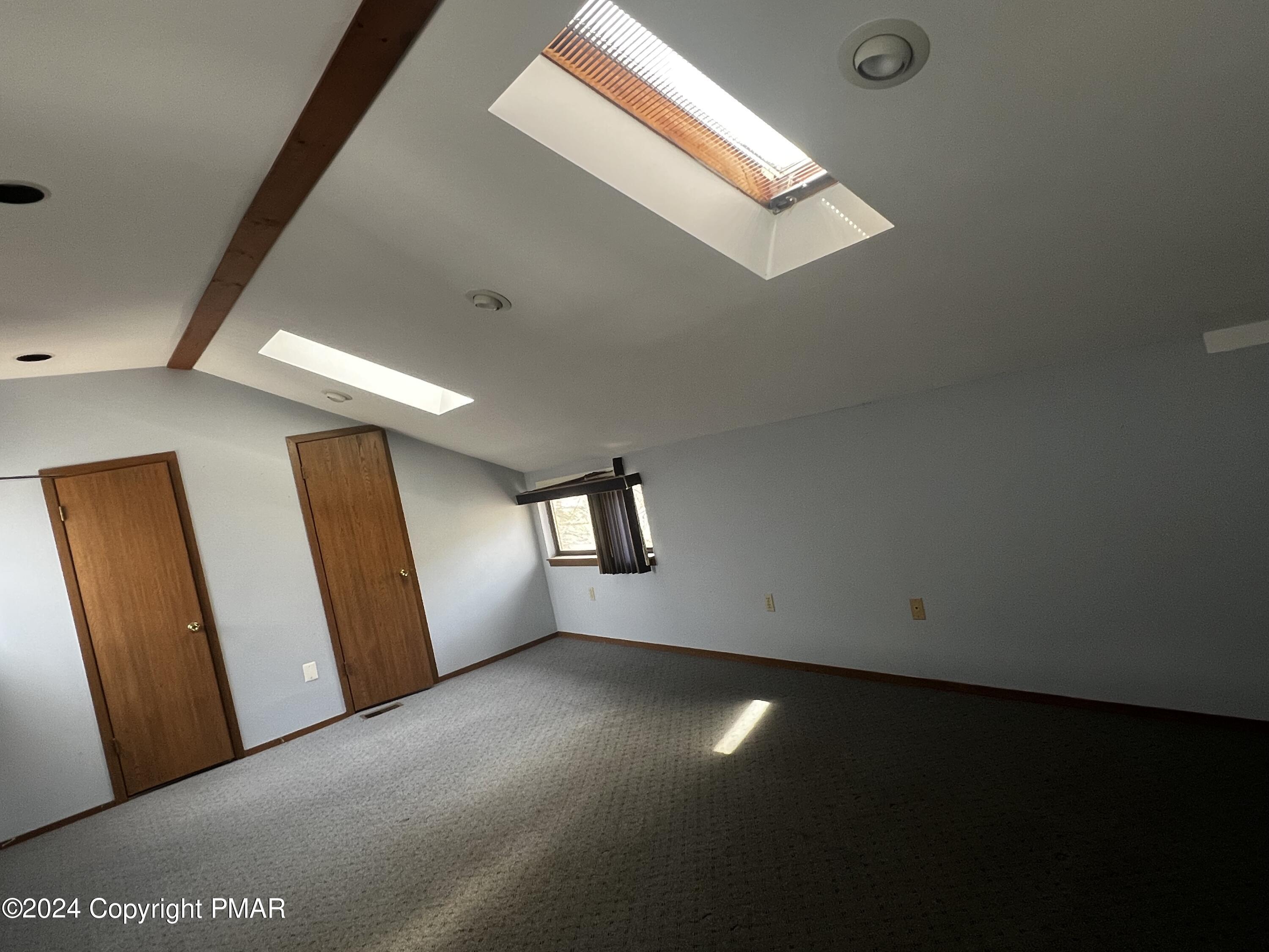 509 Wales Court Bushkill, PA 18324 - Photo 14 of 22 a view of room and hall with wooden floor