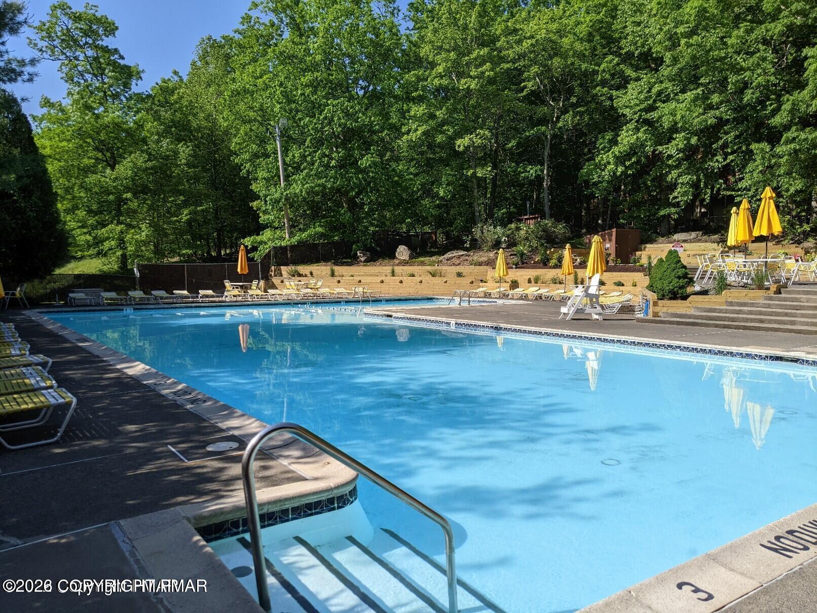 509 Wales Court Bushkill, PA 18324 - Photo 21 of 22 a view of a swimming pool with a patio